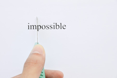 Possible Concept. Changing The Word Impossible to Possible. seperate word im and possible by cutting.の写真素材