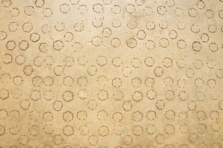 Background texture of old golden concrete floor with hexagon pattern