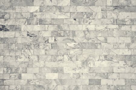 White marble wall pattern with high resolution. Brick wall made from marble use as texture and background.の写真素材