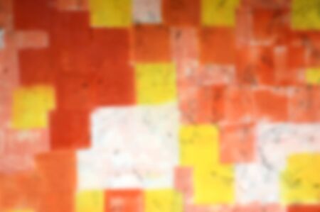 Blur Color background. Blurred Grunge orange yellow and pink painted on concrete wall.の写真素材