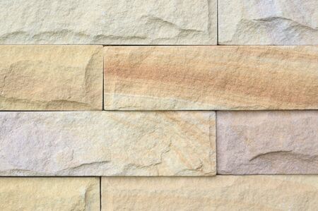 yellow brick wall pattern background close up