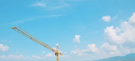 panorama of construction tower crane with blue sky with copy spaceの写真素材