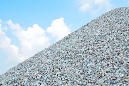 Hill of coarse aggregate with the blue sky. rock for constructionの写真素材