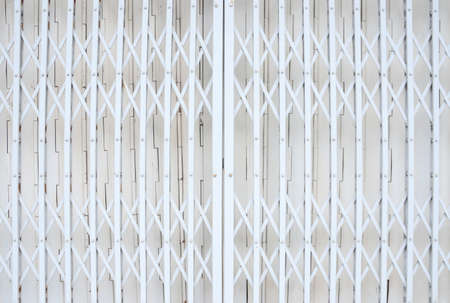 Closed slide folding steel front door white tone vintage style of townhomeの写真素材