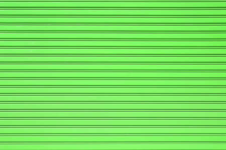 Green steel wall surface background with space for text, green metal seamless texture backgrounds, metallic pattern abstract background.の写真素材