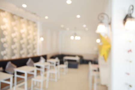Abstract blur bokeh background or defocused cafe or coffee shop  interior for design in your work...