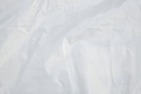 White plastic bag texture background. Abstract white curve. wave from wrinkled plastic bags