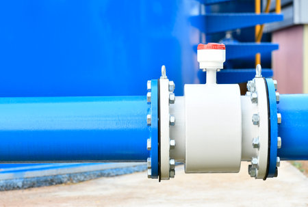 Water steel pipe and water meter close up image. Select focus of drink water piping. Flange Pipe...