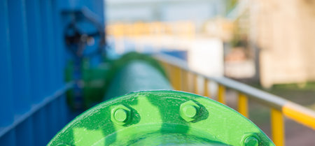 Steel flange green painted and Water Steel Pipe blurry backgroundの写真素材