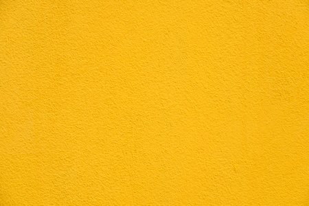 Background yellow rough wall texture surfaceの写真素材
