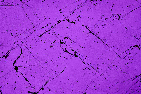 Purple background with watercolor splash on its wall surfaceの写真素材