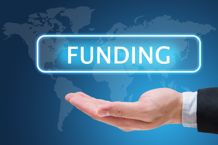 Businessman hand holding funding on virtual screenの写真素材