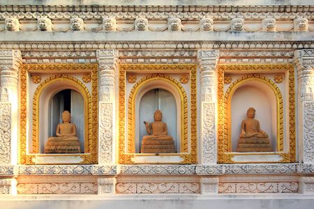 three image of buddha in wall of pagoda,Thailandの写真素材