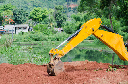 Yellow Loader backhoes working on construction site area 