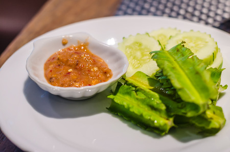 shrimp paste sauce and vegetable with hard lightの写真素材