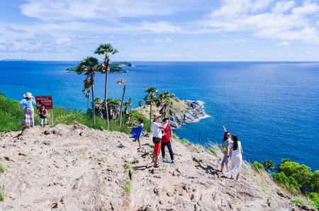 PHUKET, THAILAND - MAY 10 : Unidentified groups of tourists relax and take photo at the Phromthep...