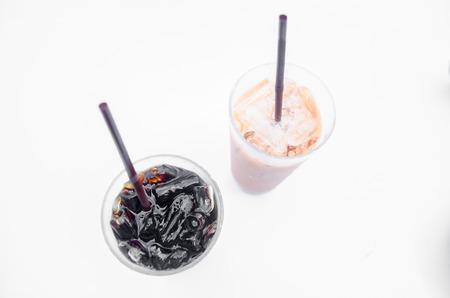 Black ice coffee ice tea on white backgroundの写真素材