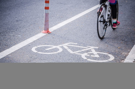 bicycle lane sign on the road with cycling