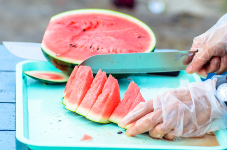 Employees are cut watermelon into piecesの写真素材