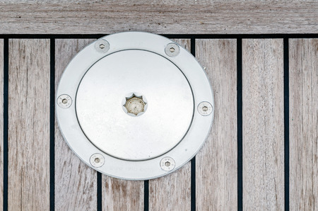 wood plank texture with Aluminium boat ground anchor pinsの写真素材