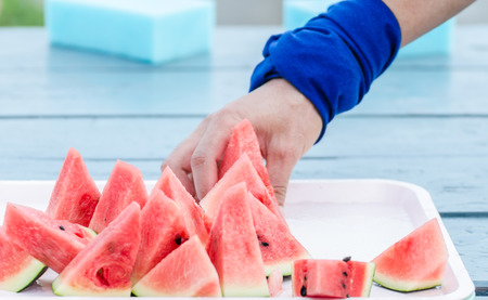 Marathon athletes are  pick  a pieces of watermelonの写真素材