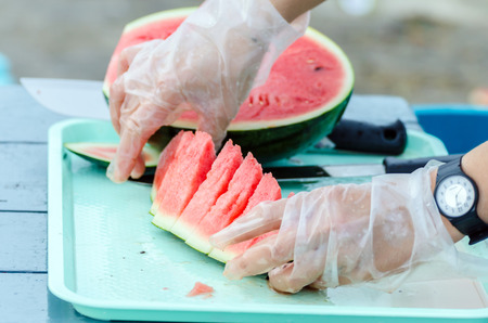Employees are cut watermelon into piecesの写真素材