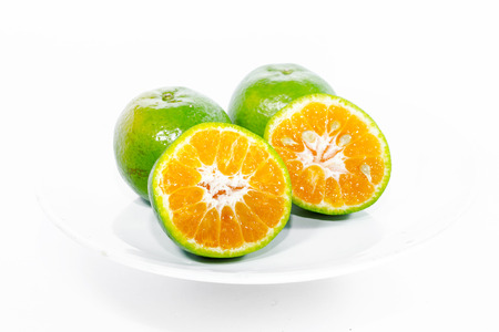 Green Orange fruit has been slitの写真素材
