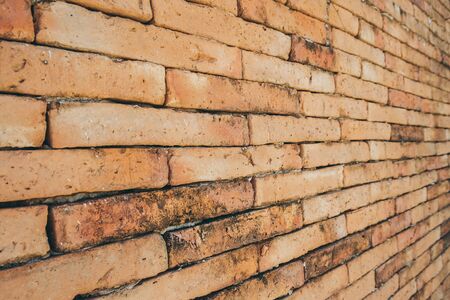 Old red brick wall, wallpaper texture backgroundの写真素材