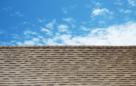 Vintage small tile roof and blue skyの写真素材