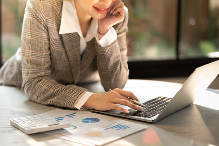 Smart woman working in the office in the morningの写真素材