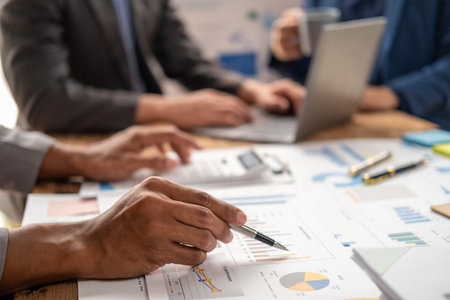 Closed up of brain storm creative thinking business project meeting discussing presentation, group teamwork together calculate figure summaryの写真素材