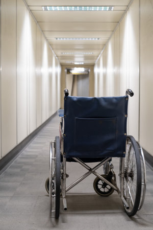 Empty wheelchair in aerobridge, empty wheelchair in walkway, empty wheelchair in airportの写真素材