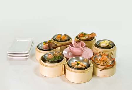 Chinese steamed dimsum in bamboo containers traditional cuisineの写真素材