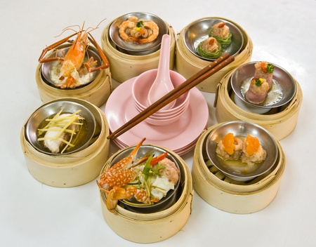Chinese steamed dimsum in bamboo containers traditional cuisineの写真素材