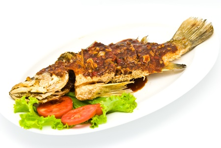 Fried snapper with chili sauce on the plate