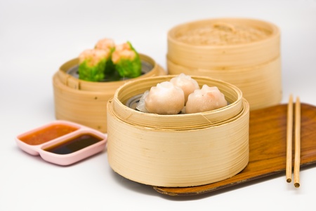 Chinese steamed dimsum in bamboo containers traditional cuisineの写真素材