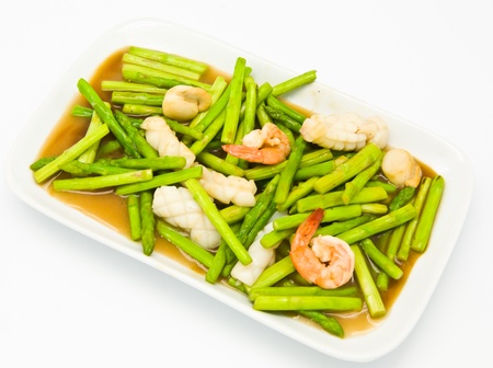 Fried asparagus with shrimp on the plate.の写真素材