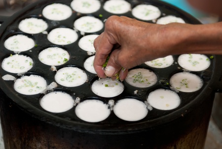 kind of Thai sweetmeat . Coconut milk mix with powder fried dessert.の写真素材