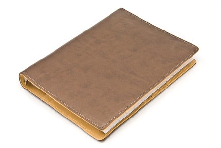 Brown notebook isolated on white backgroundの写真素材