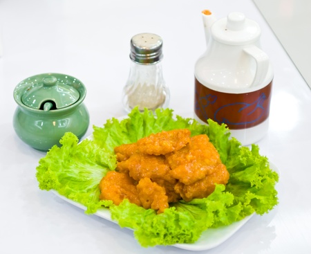 piece Fried fish with vegetable on dishの写真素材