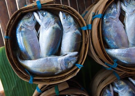 Mackerel fish in bamboo basket at market, Thailandの写真素材