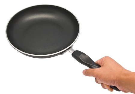 Black pan with handle on white backgroundの写真素材