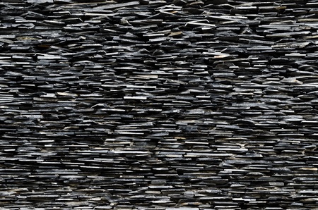 pattern of decorative slate stone wall side view surfaceの写真素材