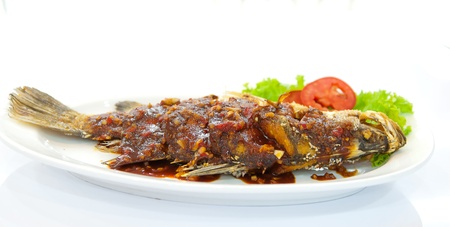 Fried snapper with chili sauce on the plate