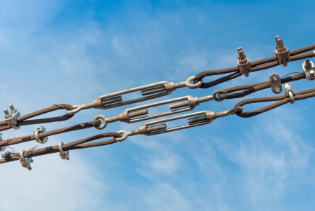 close up steel turnbuckle and sling steel in construction site on a blue sky の写真素材