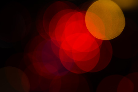 Abstract circular bokeh New Year Festive background of defocused decorated xmas tree bokeh...