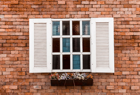 White window in old red brick wall backgroundのeditorial素材