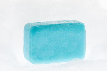 close up of a beautiful blue soap with foam on white backgroundの写真素材