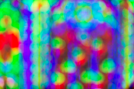 Abstract circular light bokeh New Year Festive background of defocused decorated xmas tree bokeh compositionの写真素材