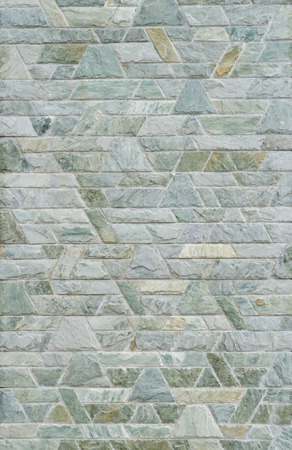 pattern color of modern style  design decorative  green slate stone wall surface with cement in trapezoid shapeの写真素材